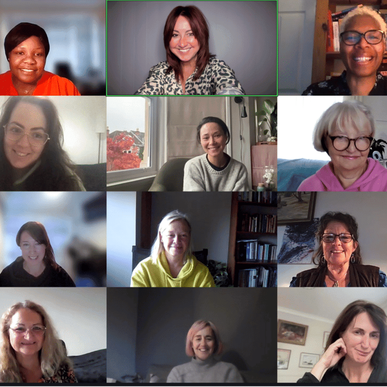 Women smiling during a virtual meeting on a video call.
